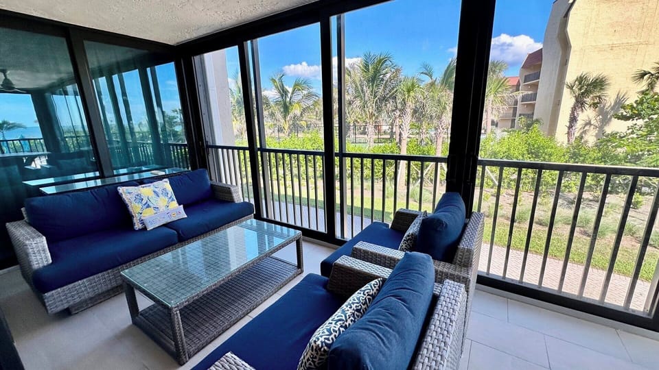 The lanai overlooks the pool, grills and gulf.