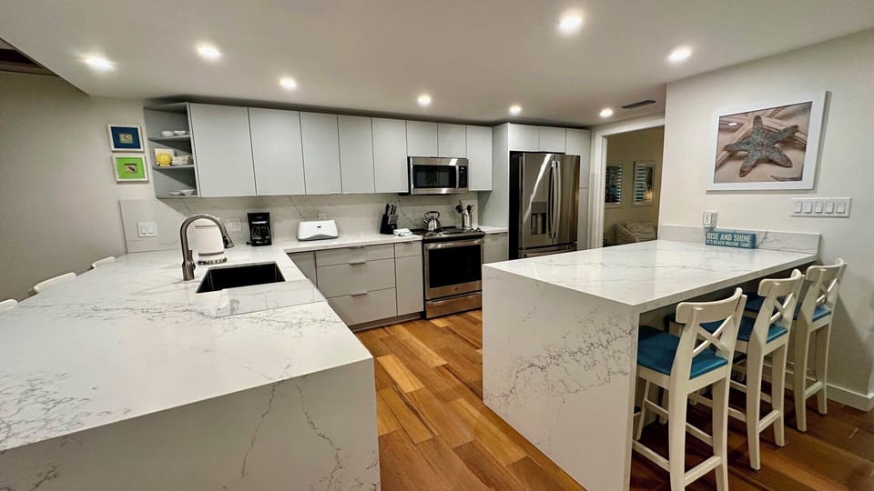 Quartz countertops, stainless appliances and ample storage.