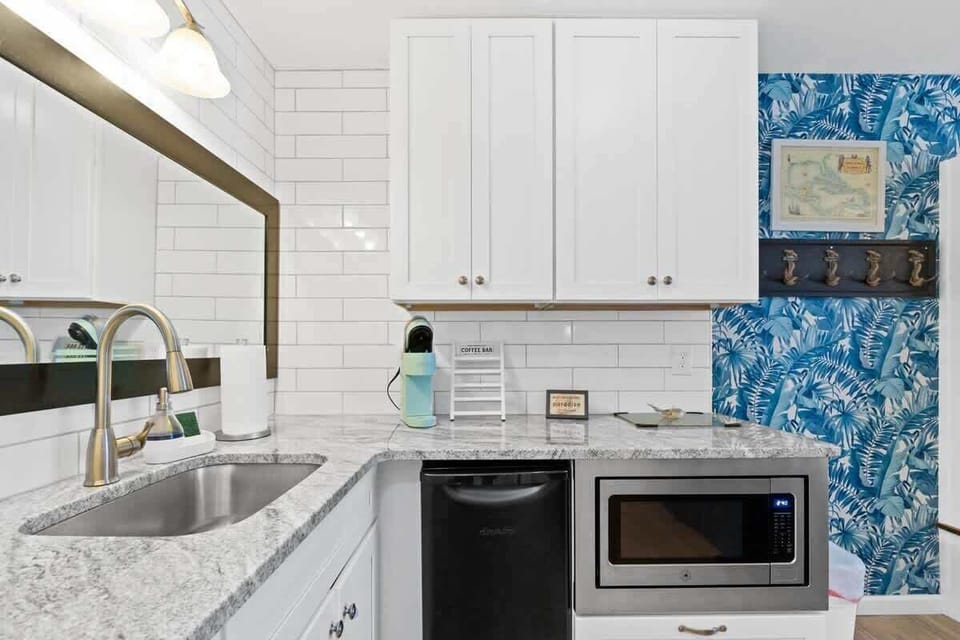 Convenient kitchenette equipped with a microwave and mini refrigerator