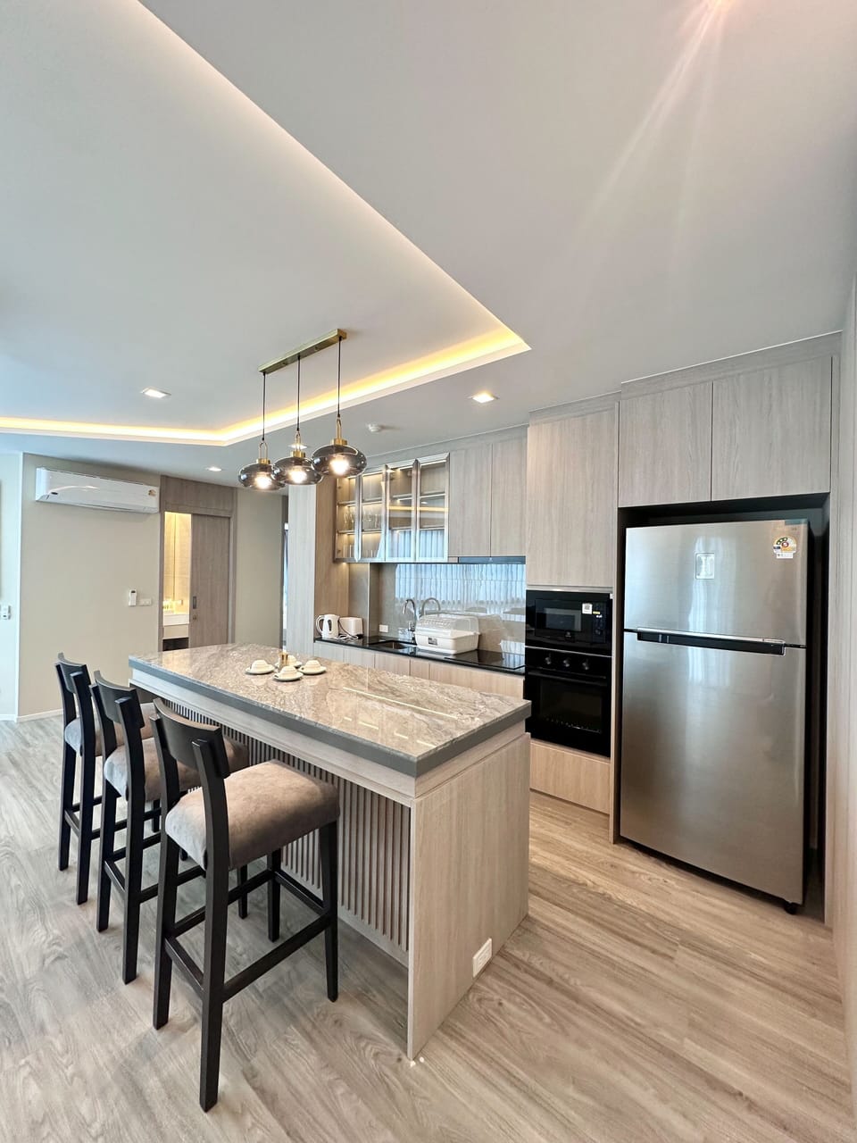 Deluxe Family Two-Bedroom | Private kitchen | Full-size fridge, microwave, stovetop