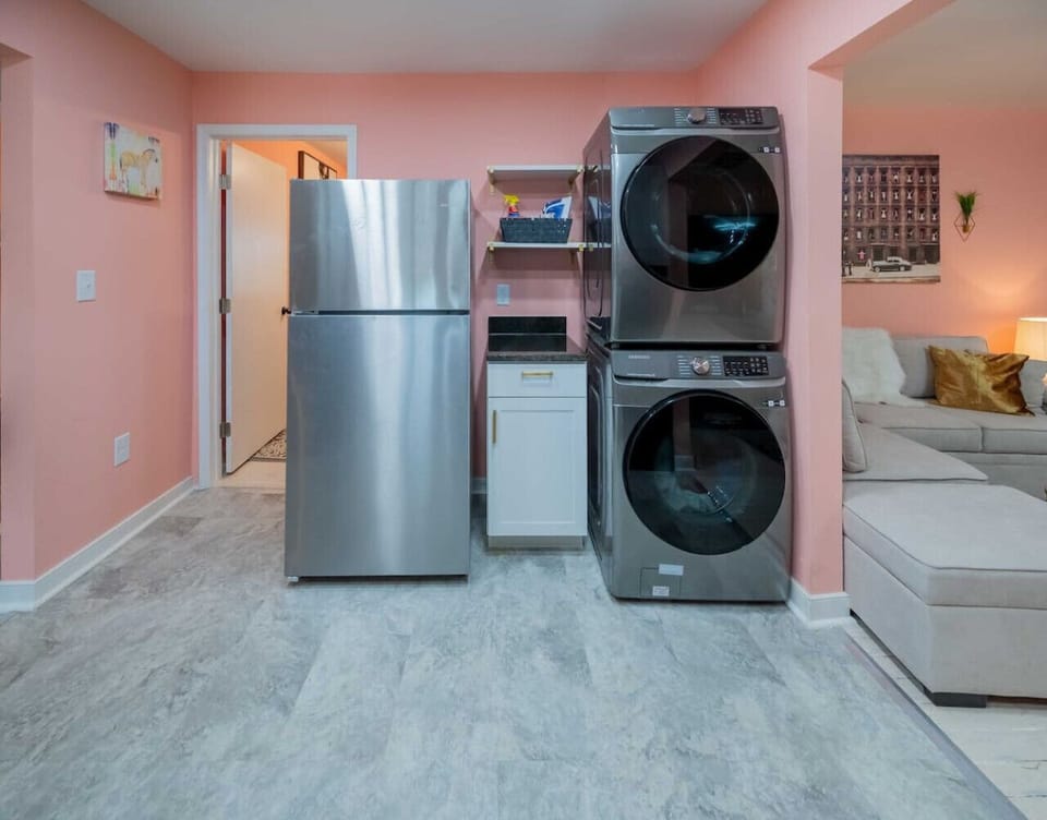 Discover our kitchen with a full fridge and washer/dryer, offering modern conveniences to enhance your stay with us.