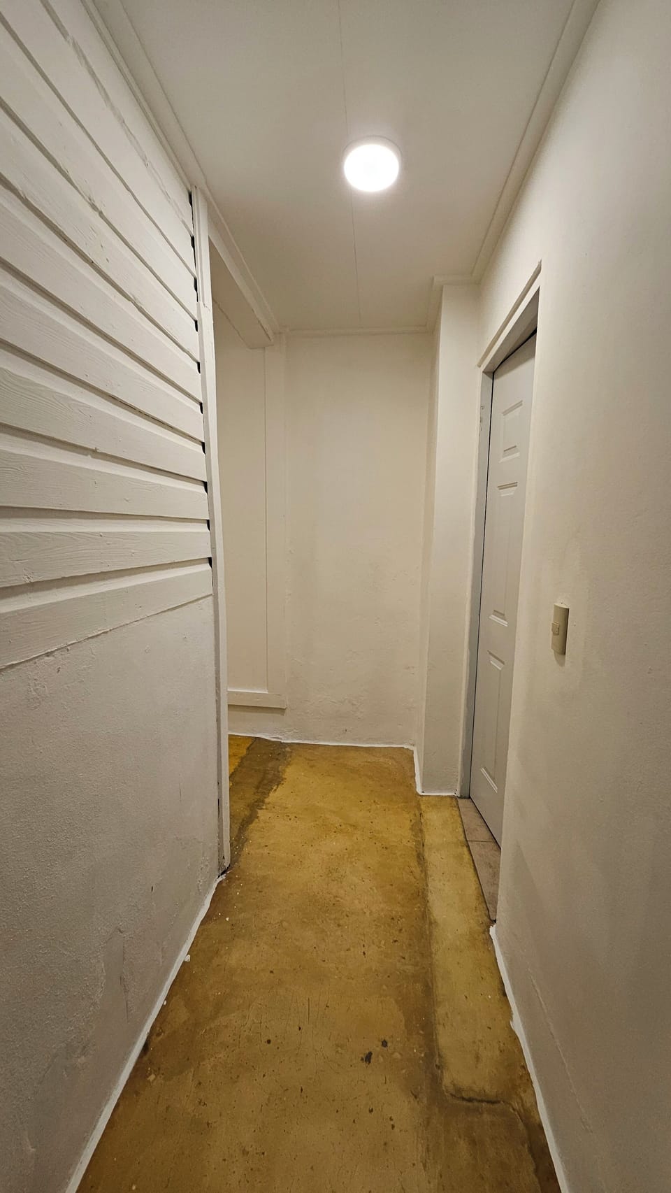 Hallway leading to third bedroom