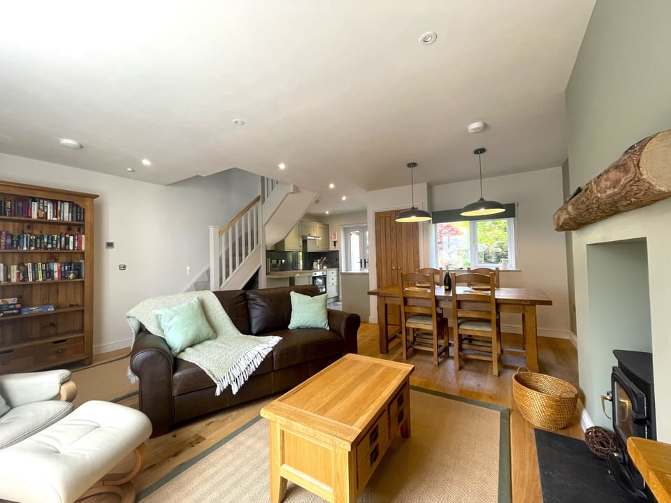 The open plan living/dining and kitchen area is tastefully decorated in soft colours