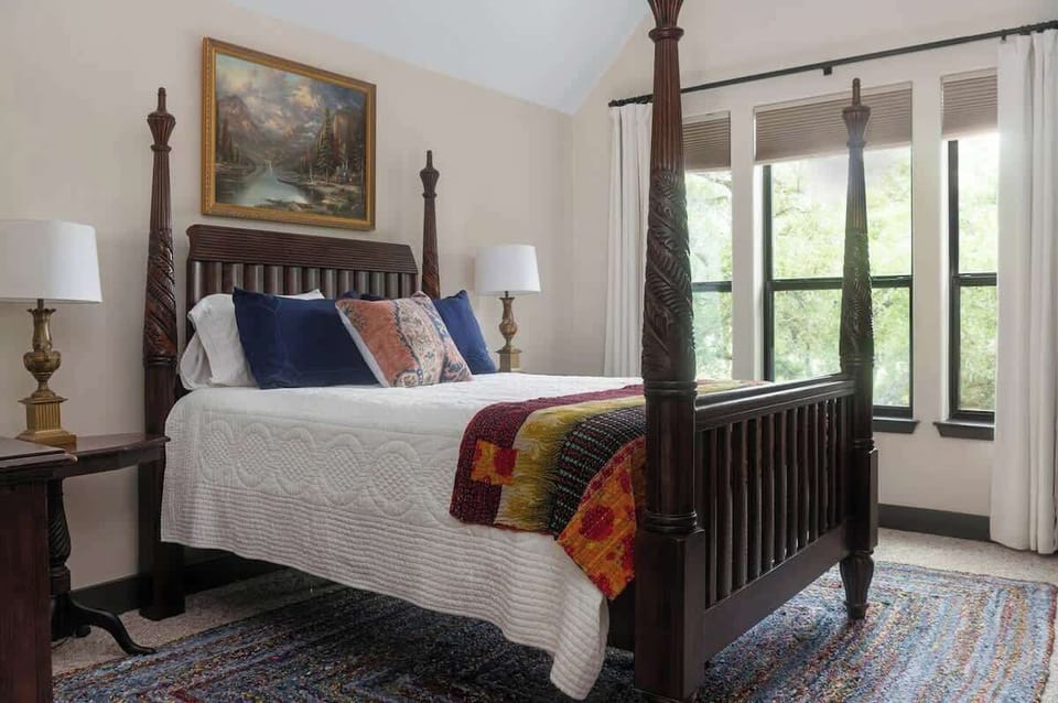 A warm and welcoming upstairs queen bedroom, perfect for winding down after a full day together.