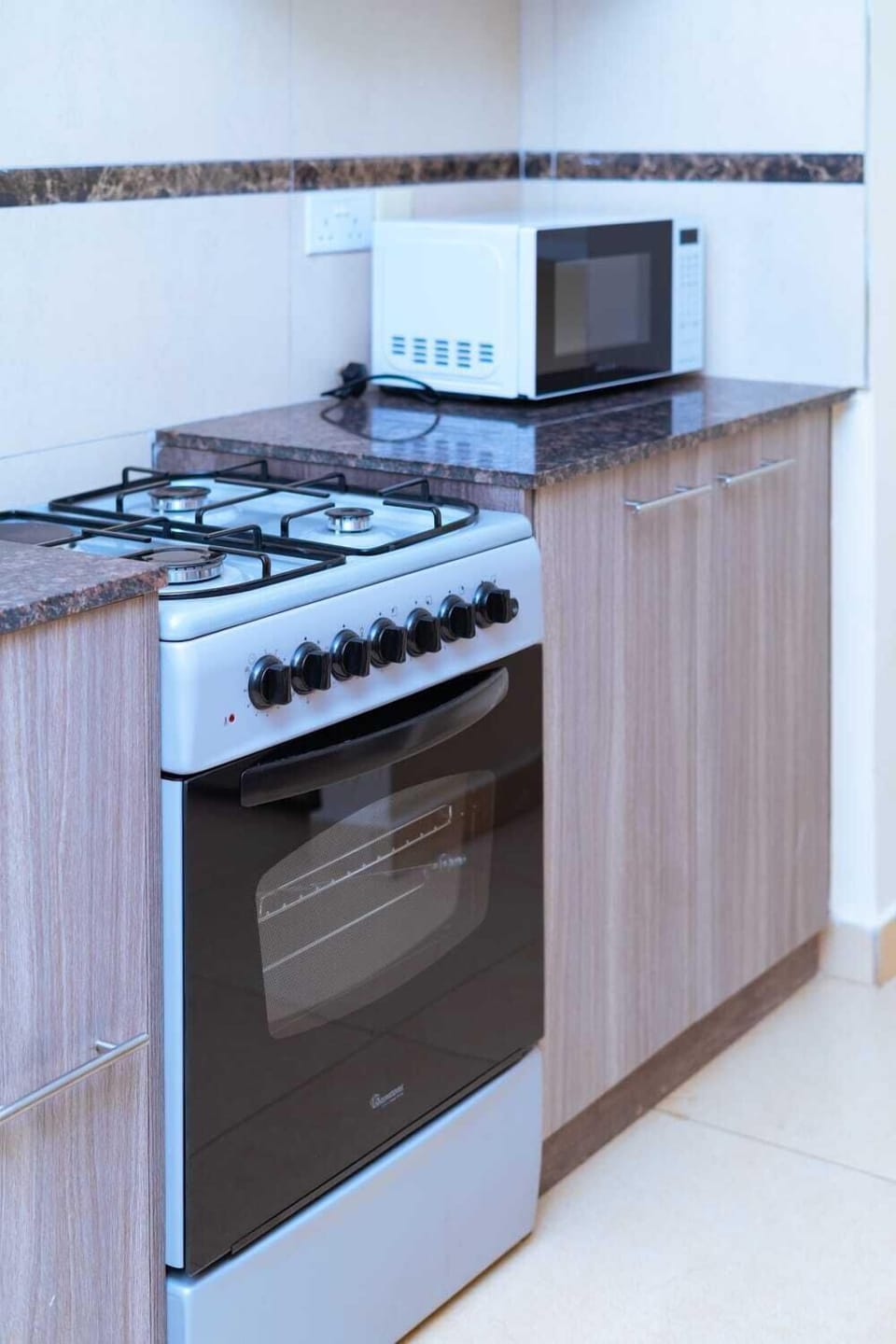 Family Apartment | Private kitchen | Fridge, microwave, cookware/dishes/utensils, dining tables