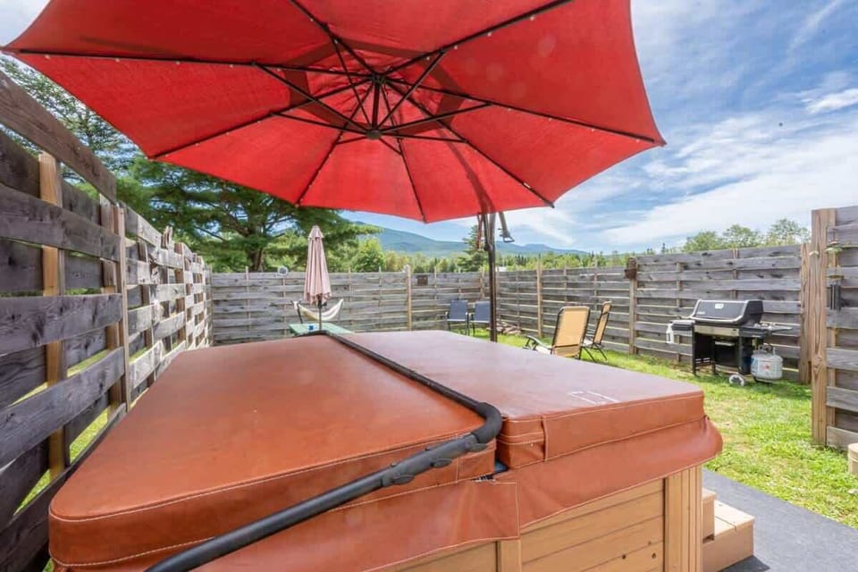 Hot Tub Retreat: Unwind under the sun with mountain views and your own private oasis!
