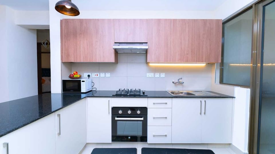 Deluxe Apartment, Balcony, City View | Private kitchen | Microwave, cookware/dishes/utensils