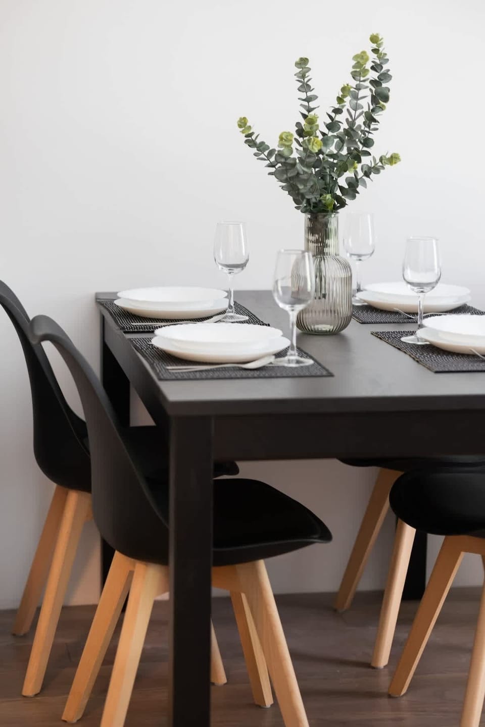 Large table with chairs for eating communal meals. 