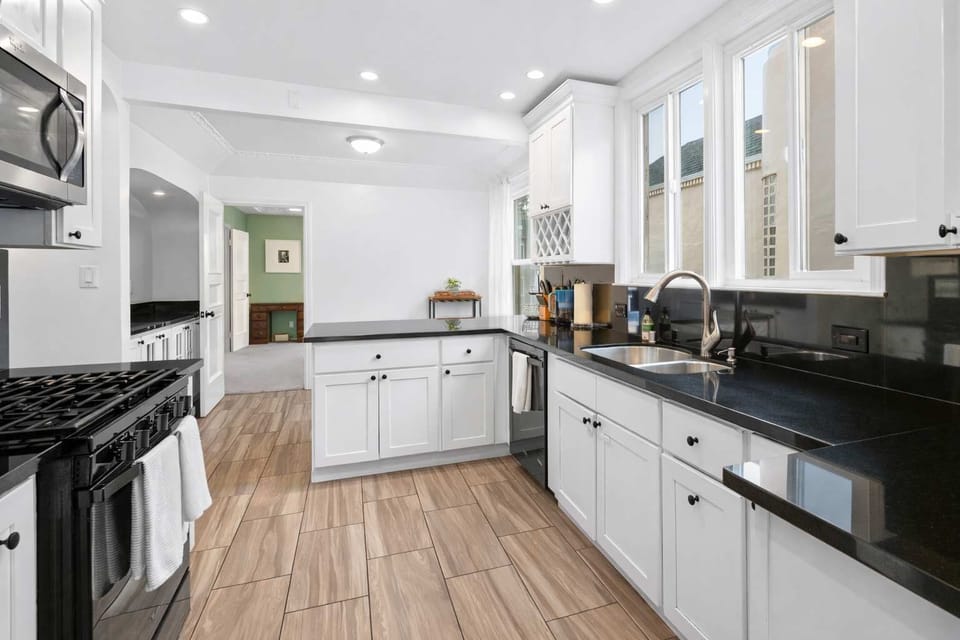 Sleek and modern kitchen with spacious counters, quality appliances, and plenty of room to prepare meals with ease.