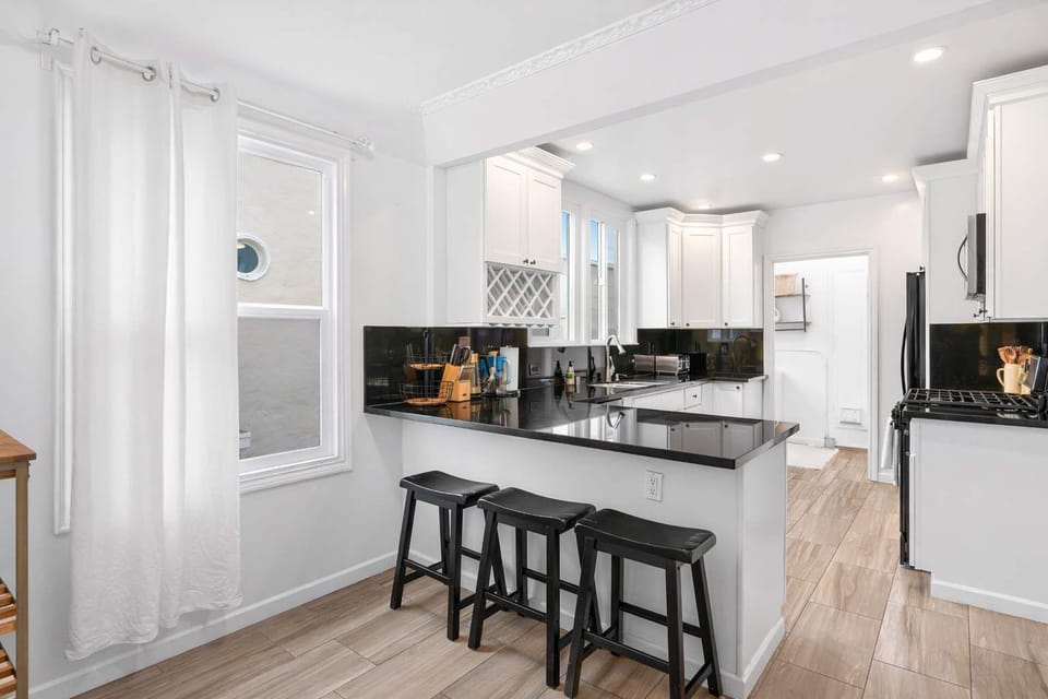 Spacious kitchen with a large island, stylish finishes, and plenty of room for preparing meals and enjoying casual dining.