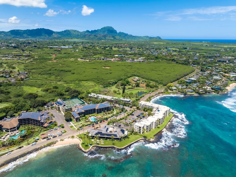 Mountains behind you. Ocean in front of you. Poipu Beach around the corner.