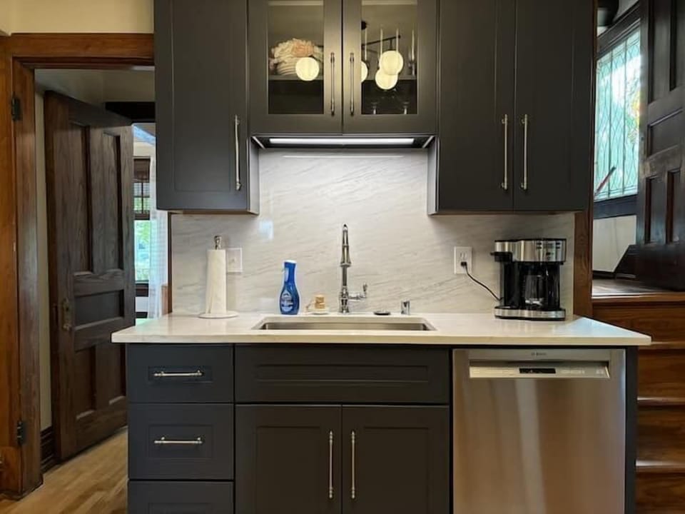 Modern, fully equipped kitchen with stainless steel appliances & sleek cabinetry