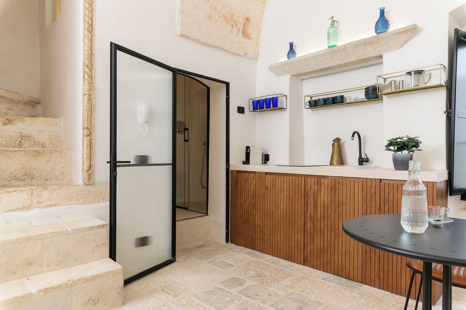 Apartment | Private kitchen | Espresso maker, dining tables