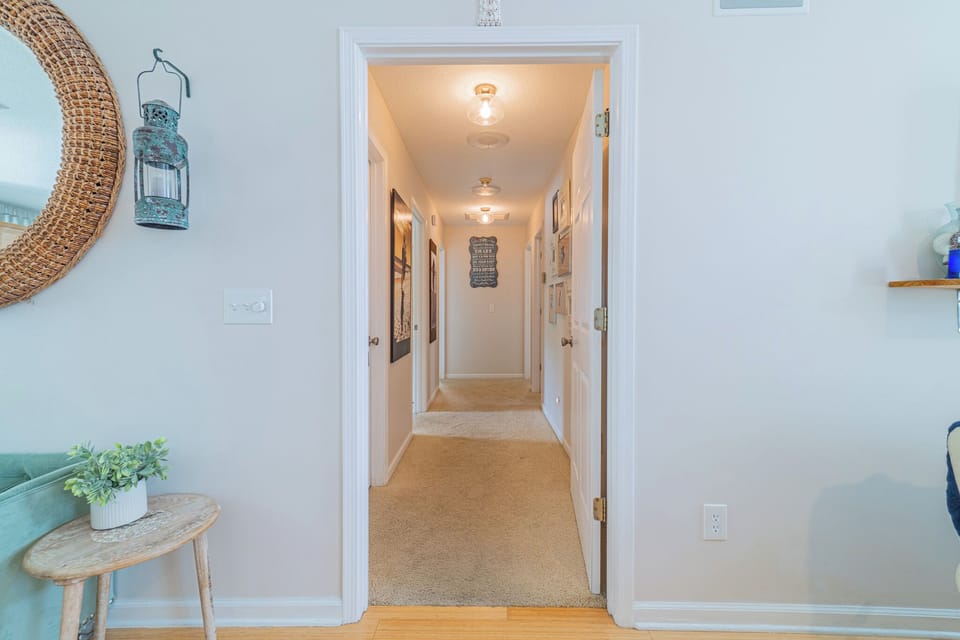 Additional bedrooms and bathrooms on west side of home