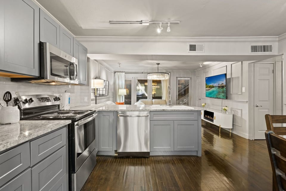 Spacious kitchen with sleek, modern appliances, fully equipped for all your cooking and dining needs.