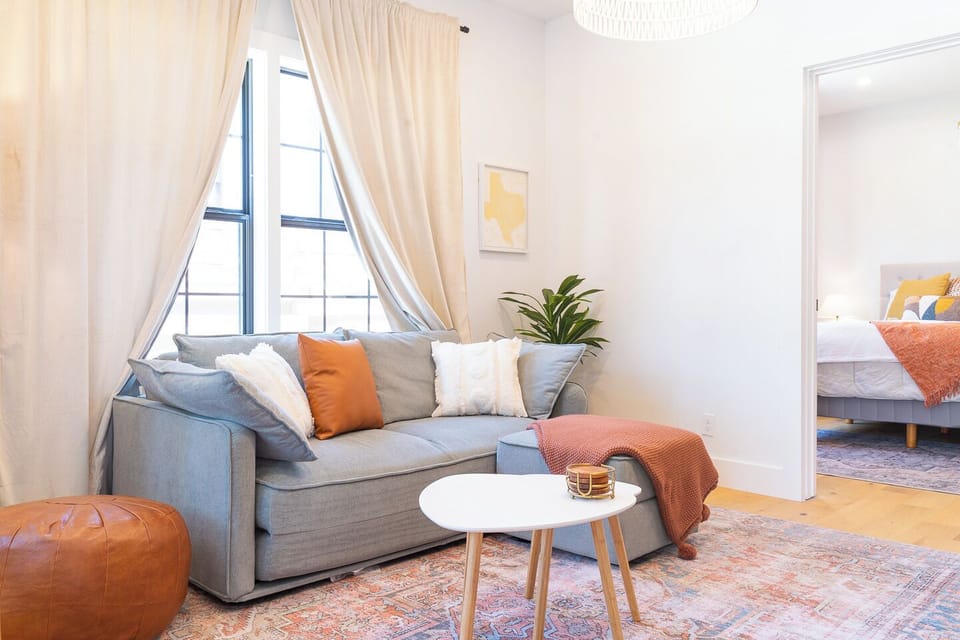 Cozy Queen-size pull-out couch, perfect for lounging and extra guests.
