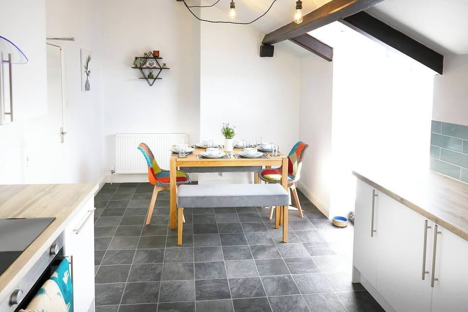 Kitchen/diner Designed for comfortable dining experiences, it may also include decor elements such as lighting fixtures.