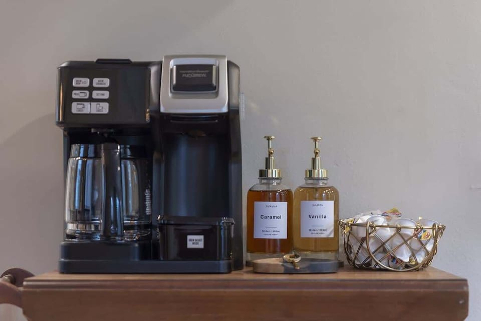 Coffee station setup w/ machine, mugs & essentials for your morning routine