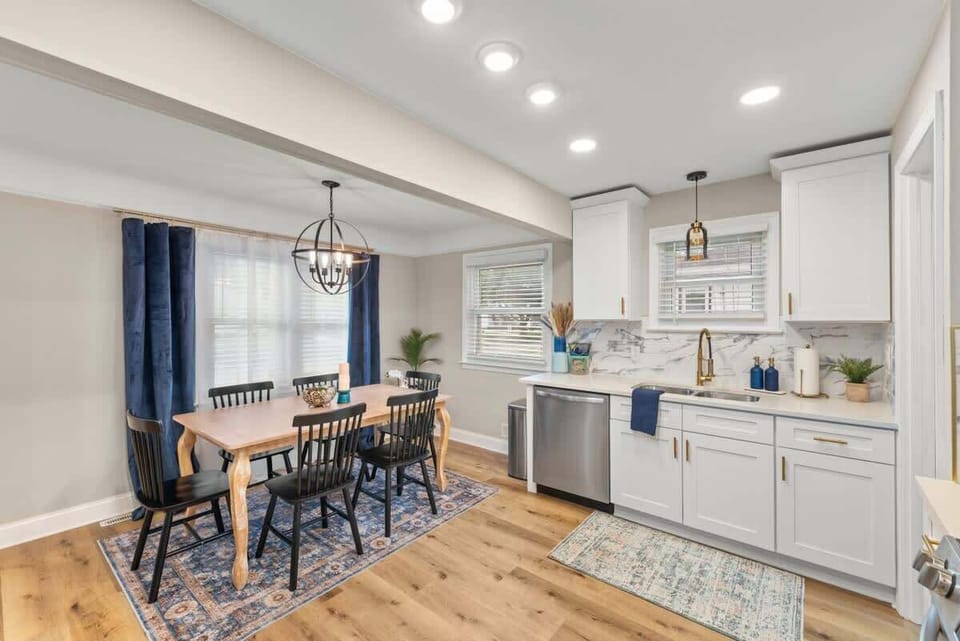 Dining area w/ table set near kitchen, perfect for gathering