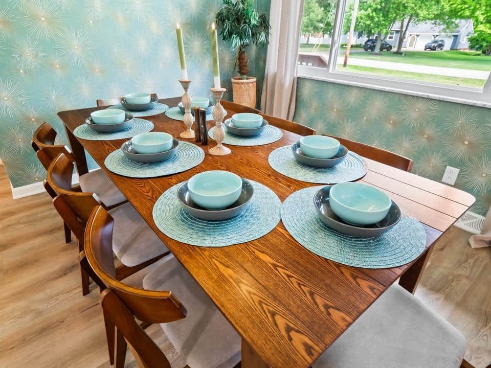 Bright dining area by large windows, perfect for relaxed meals w/ plenty of natural light
