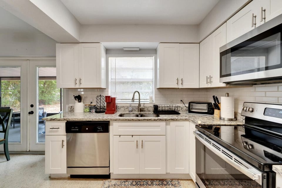 Fully stocked kitchen with all the essentials, complemented by bar seating for casual dining or socializing