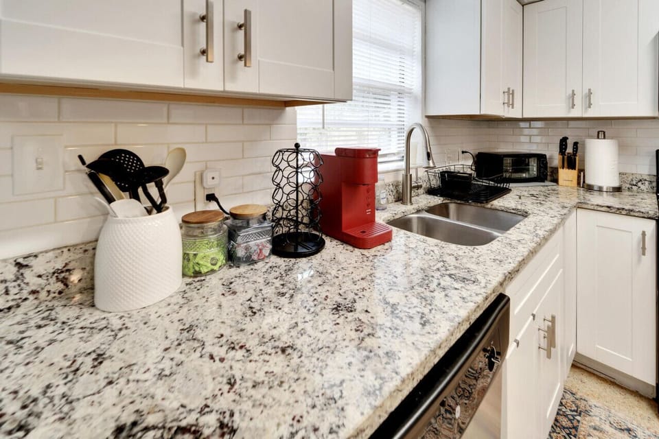 Fully stocked kitchen with all the essentials, complemented by bar seating for casual dining or socializing