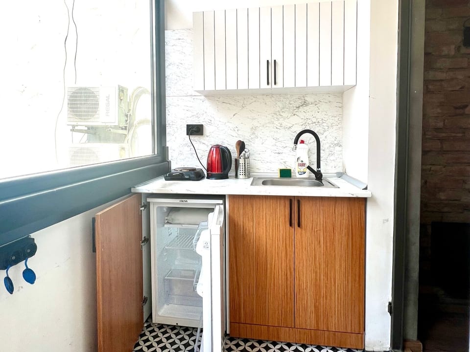 Standard Apartment | Private kitchen | Mini-fridge, stovetop, cookware/dishes/utensils