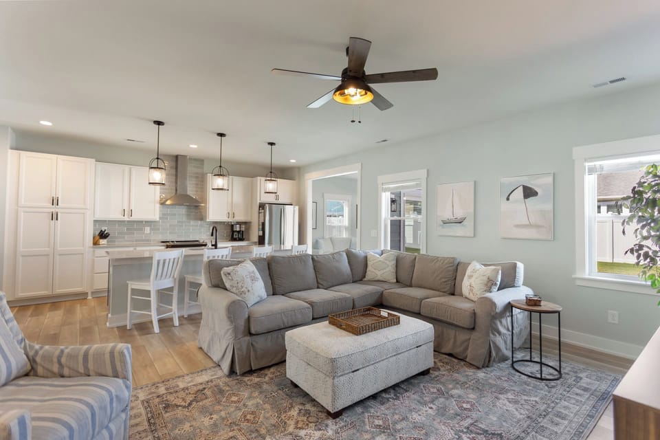 Relax after a fun day exploring the beach in the spacious Living Area with a large flat-screen TV and plenty of comfortable furniture for lounging.