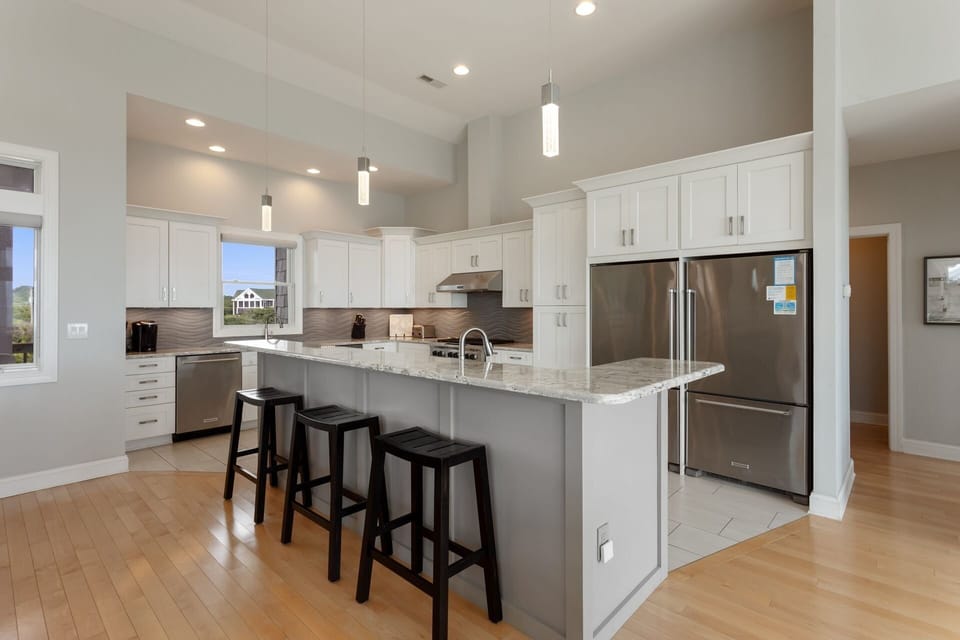 Whip up something delicious in the Kitchen with 2 Full-Size Refrigerators, 2 Dishwashers, 2 Ovens, and a Range with a Hood to create the perfect vacation dining experience!