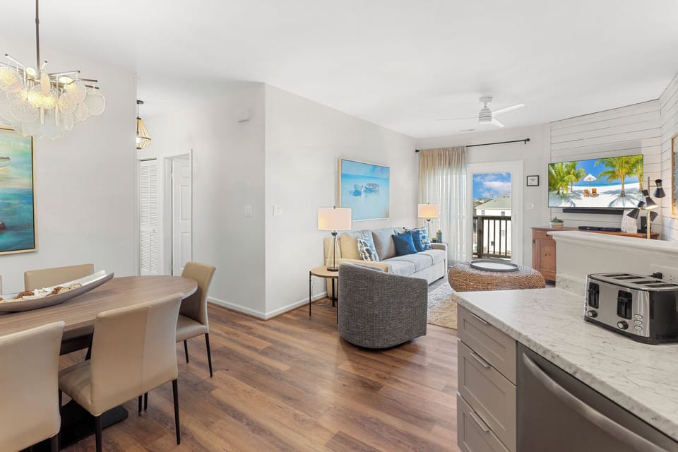 The open-concept floor offers a bright and airy atmosphere for your vacation.