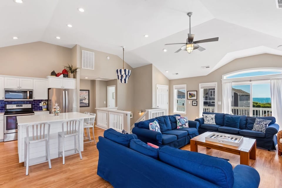 Relax in the spacious Living Area with bright furniture and natural light as well as a Flat Screen TV!