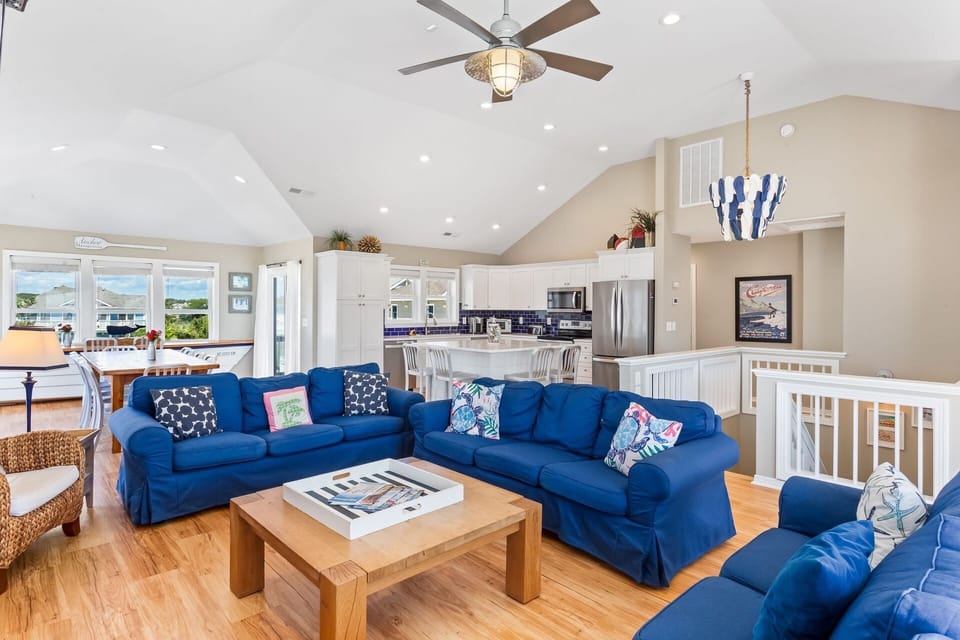 Relax in the spacious Living Area with bright furniture and natural light as well as a Flat Screen TV!