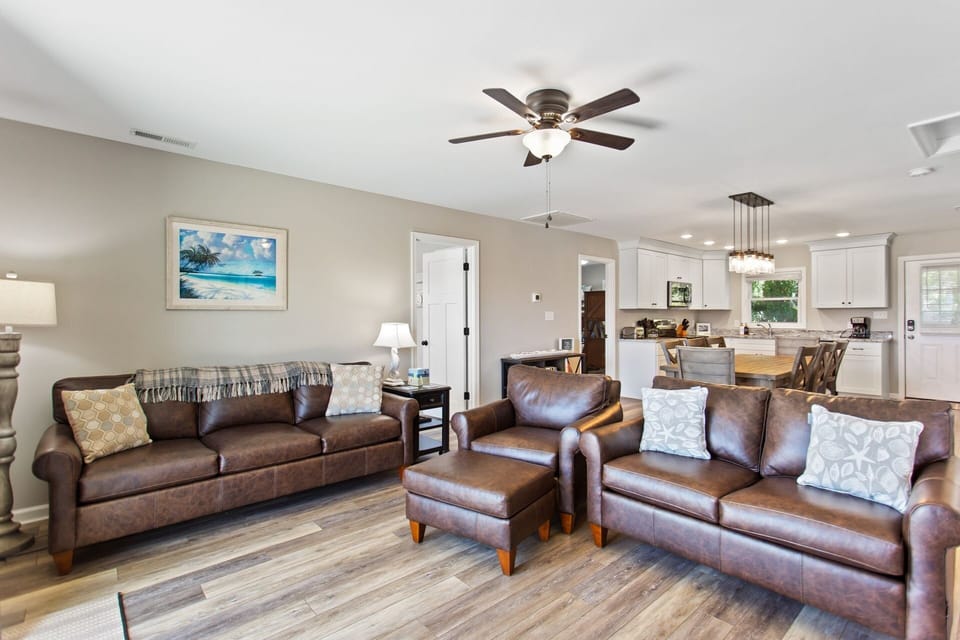 Enjoy the beautiful, open-concept living area with a large flat screen TV and cozy furniture.
