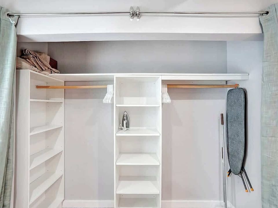 Built-in closet with shelving and hanging space