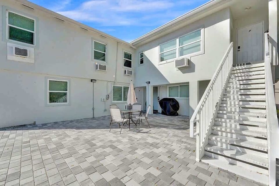 Open courtyard with patio furniture and staircase