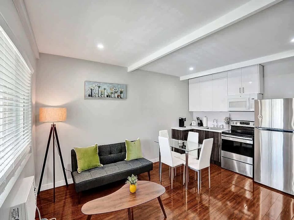 Bright living room with sofa and wood floors