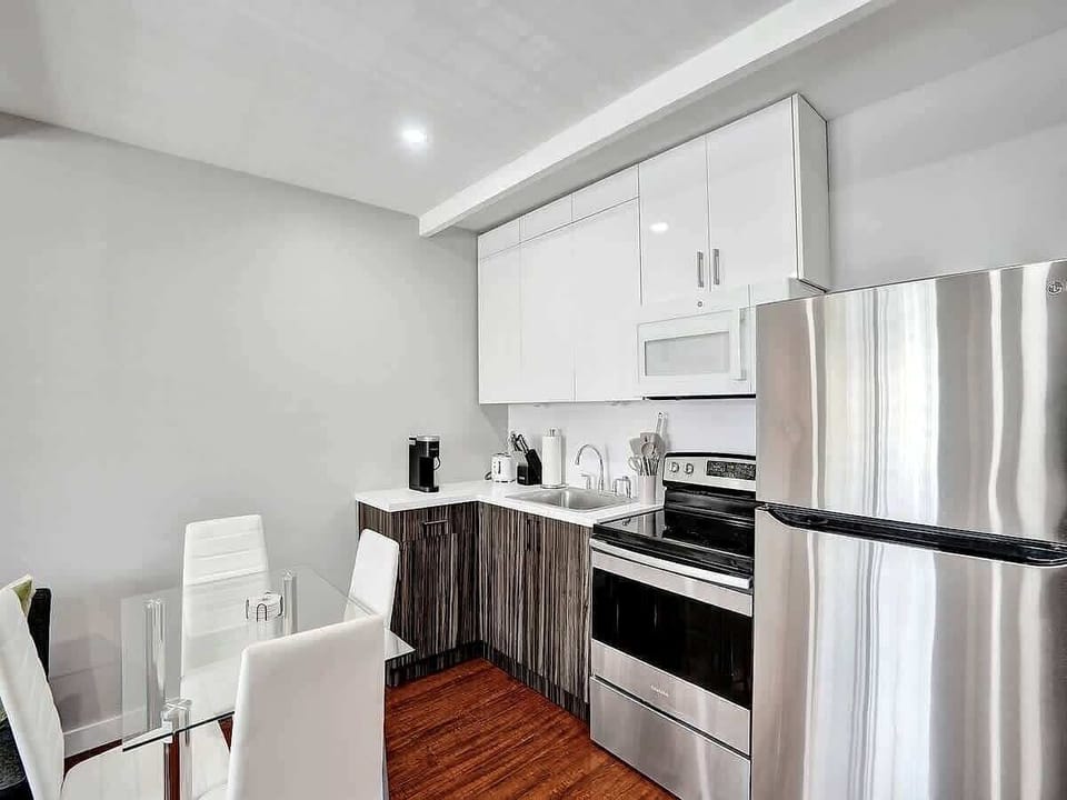Kitchen appliances and white cabinetry close-up