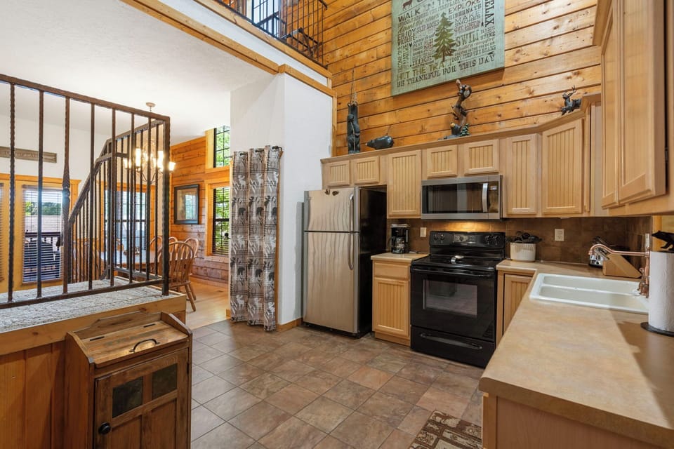 Kitchen Opens to the Dining area and Stairs Leading to the Upper Level