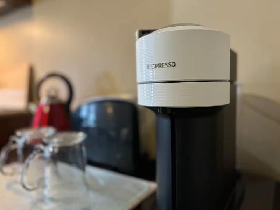 Convenient coffee station with espresso maker ready for your morning brew
