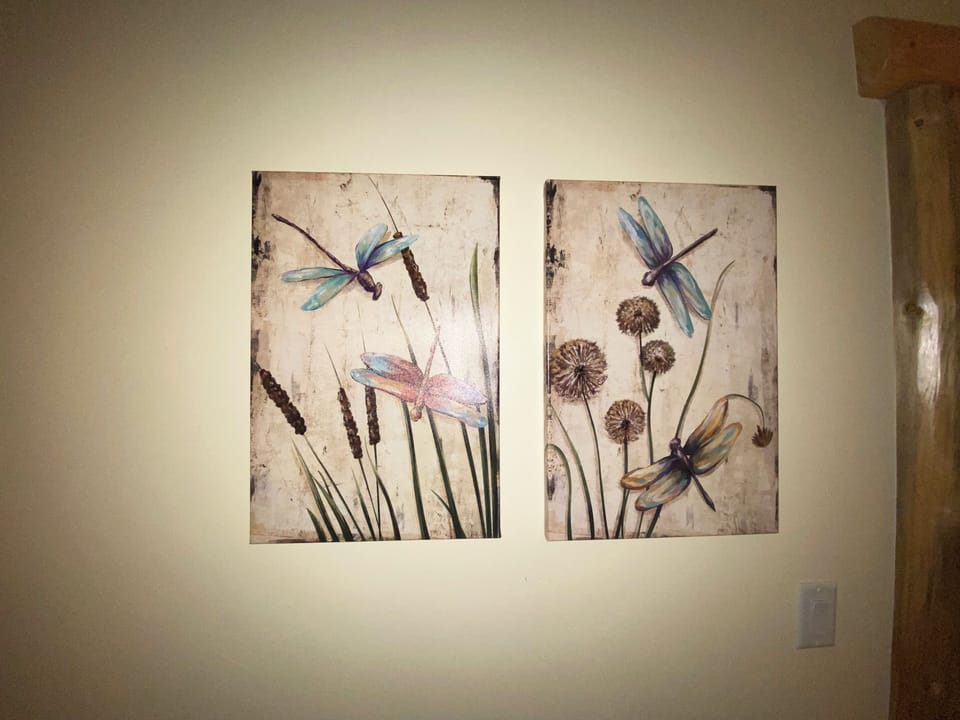 Artwork in primary bedroom suite.