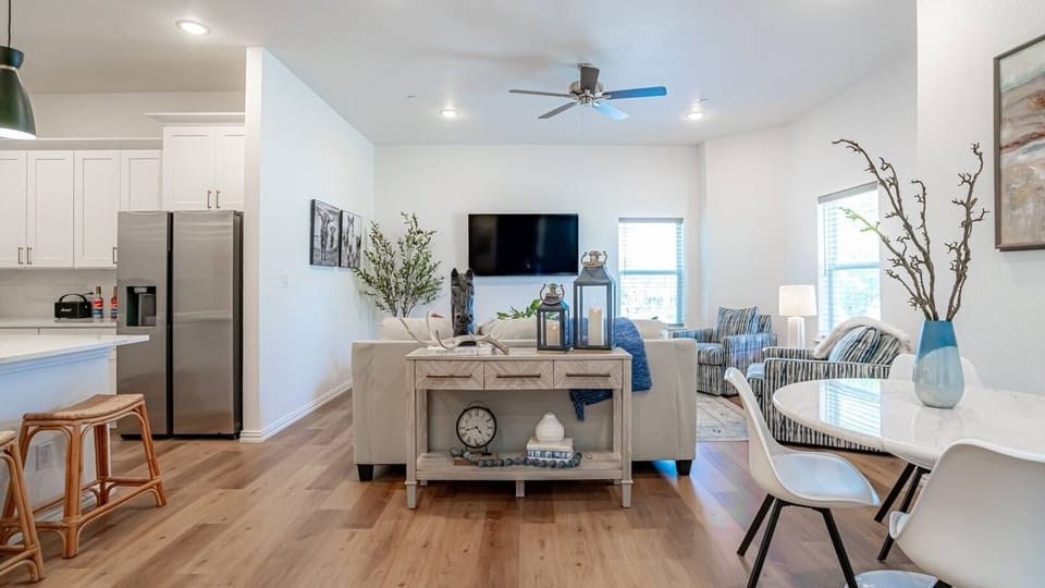 Kick back in a stylish, open-concept living space designed for comfort and connection. Whether you're debriefing after a Rangers game, watching pre-game coverage on the smart TV or just relaxing with your crew—The Ryan's living area has you covered.