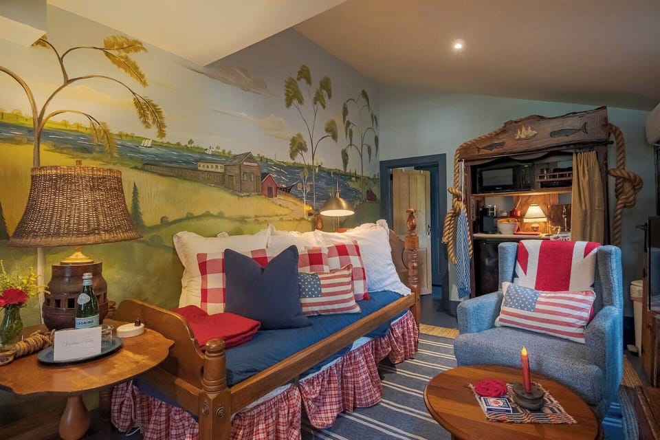 A mural depicting the Plymouth Cordage building at the Mystic Seaport by artist Susan Dwyer Leach- Fabulous!
The door on the right leads to the bathroom.