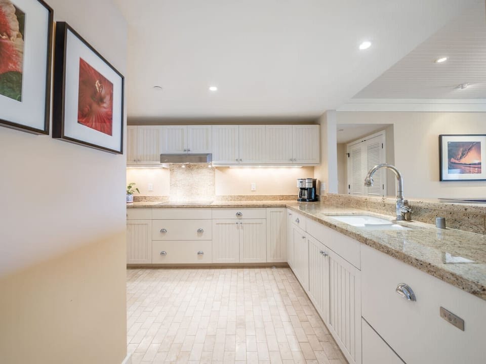 Granite countertops, Wolf stove cook top and Wolf built in oven, convection microwave oven, Sub-Zero fridge/freezer