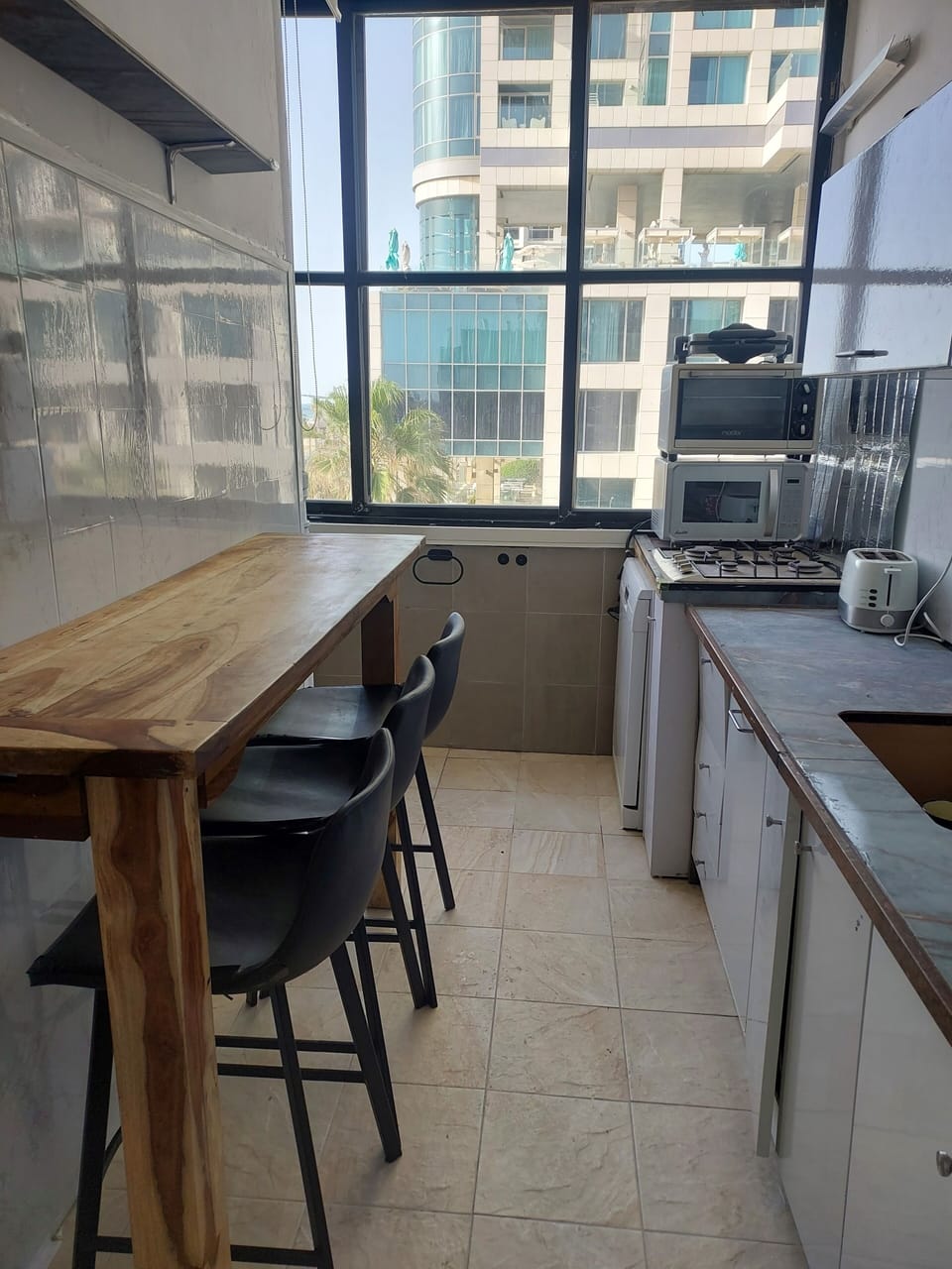 Comfort Apartment, Balcony, Beach View | Private kitchen | Full-size fridge, microwave, stovetop, dishwasher