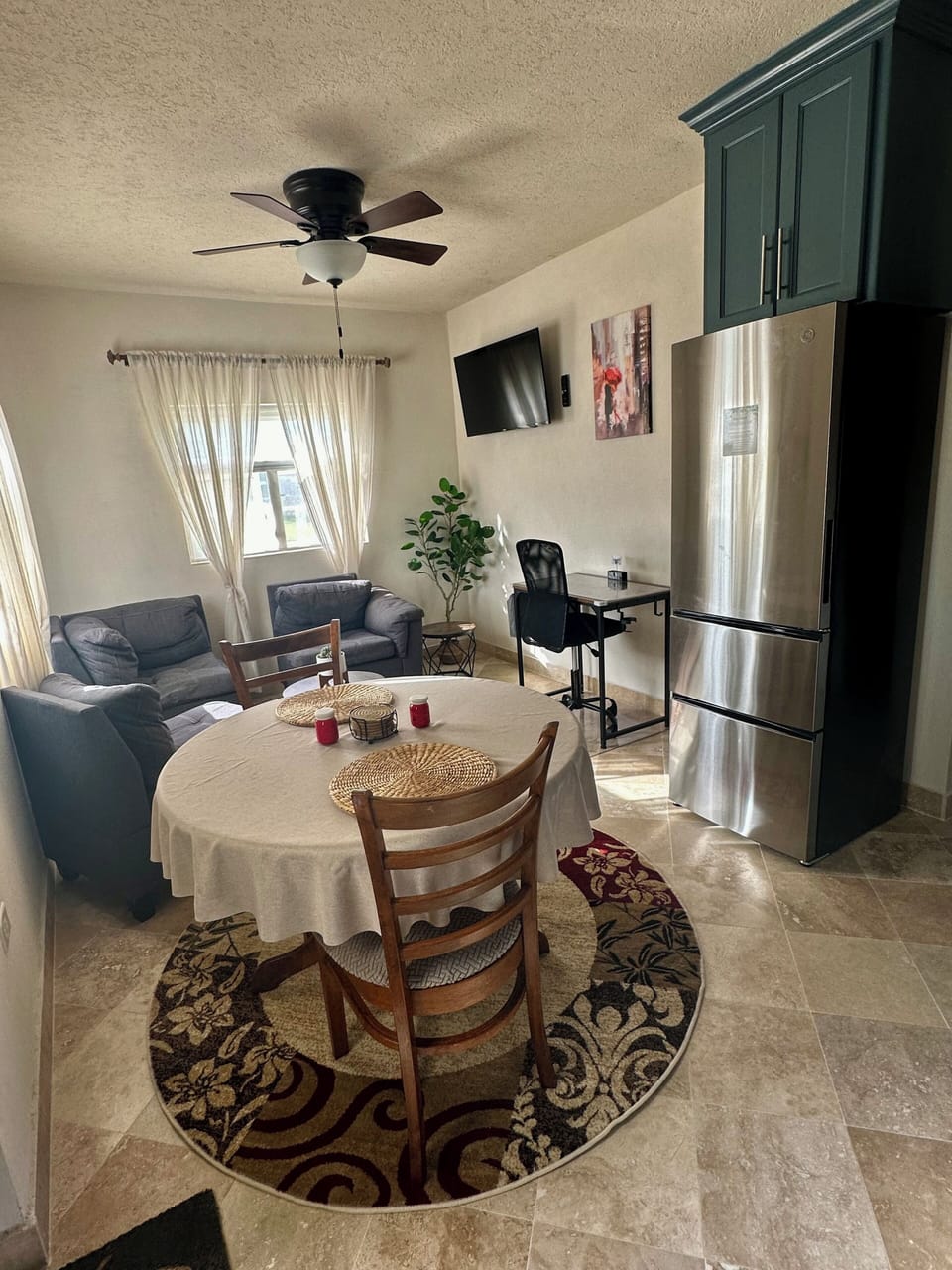 Living and dining space with dedicated computer desk.