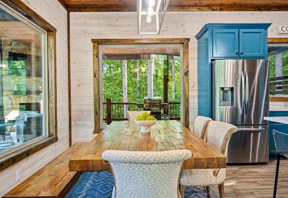 The dining area is perfect for family meals, with a rustic table that invites everyone to gather around.