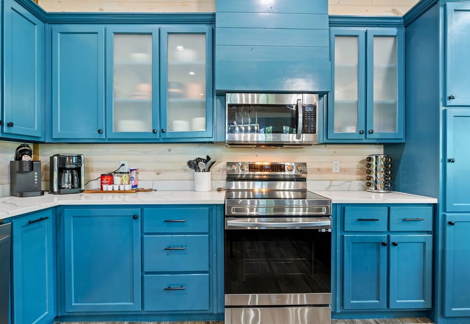 This bright and modern kitchen is equipped with everything you need to cook up a delicious meal during your stay.