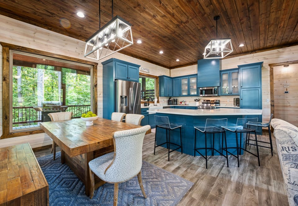 The kitchen is a cook’s dream, featuring modern appliances, ample counter space, and a stylish design.