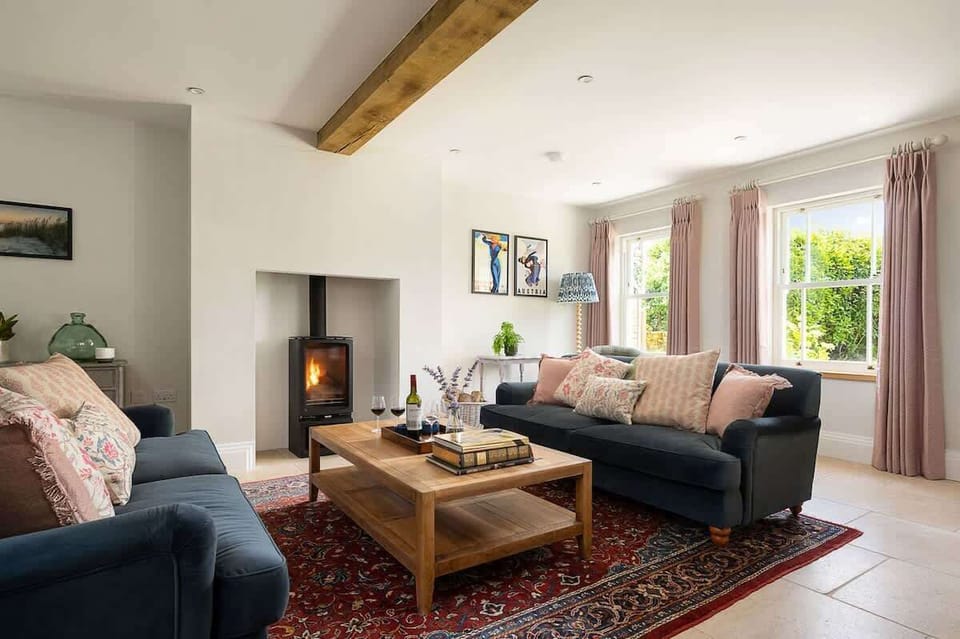 Cosy living room with log burner, TV and ample comfy seating