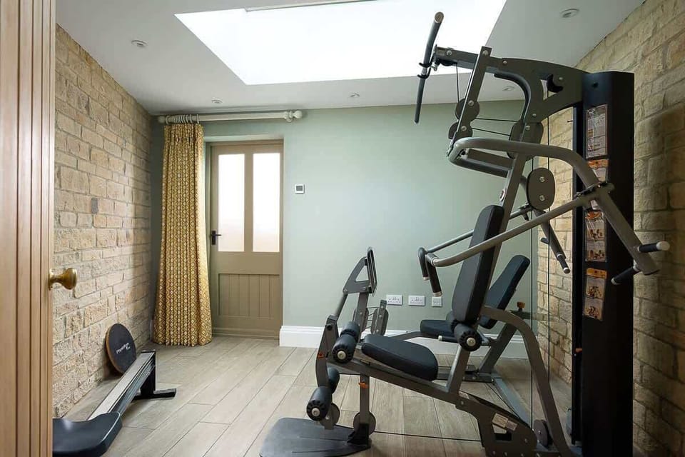 Private gym with rowing machine and weights